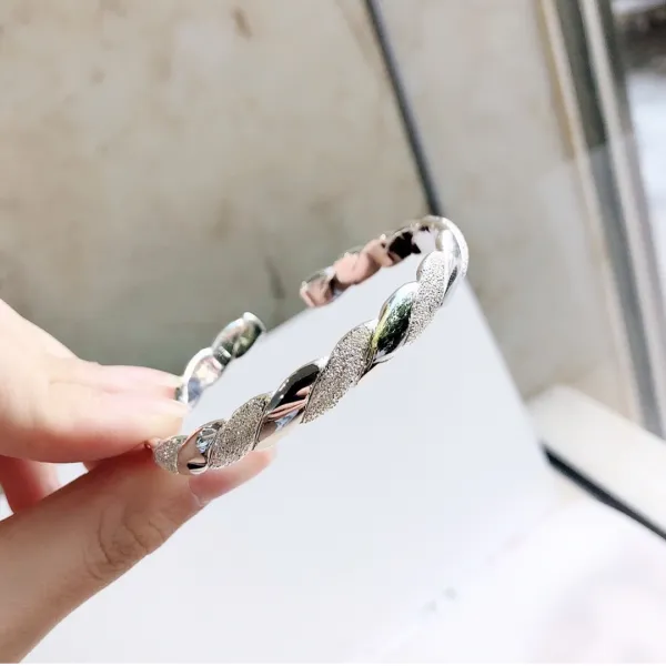 DFMEI s999 실버 이니셜 꽈배기 헤어 오픈 풋 실버 팔찌 스크럽 광면 크로스 패션입니다.예의를 갖추다